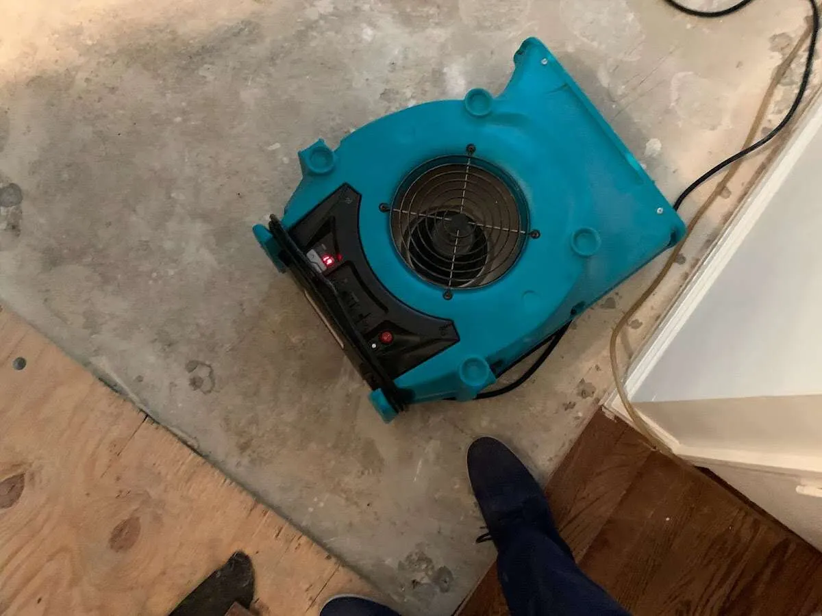Air mover drying subfloor during Commercial Water Damage Restoration in Blythewood